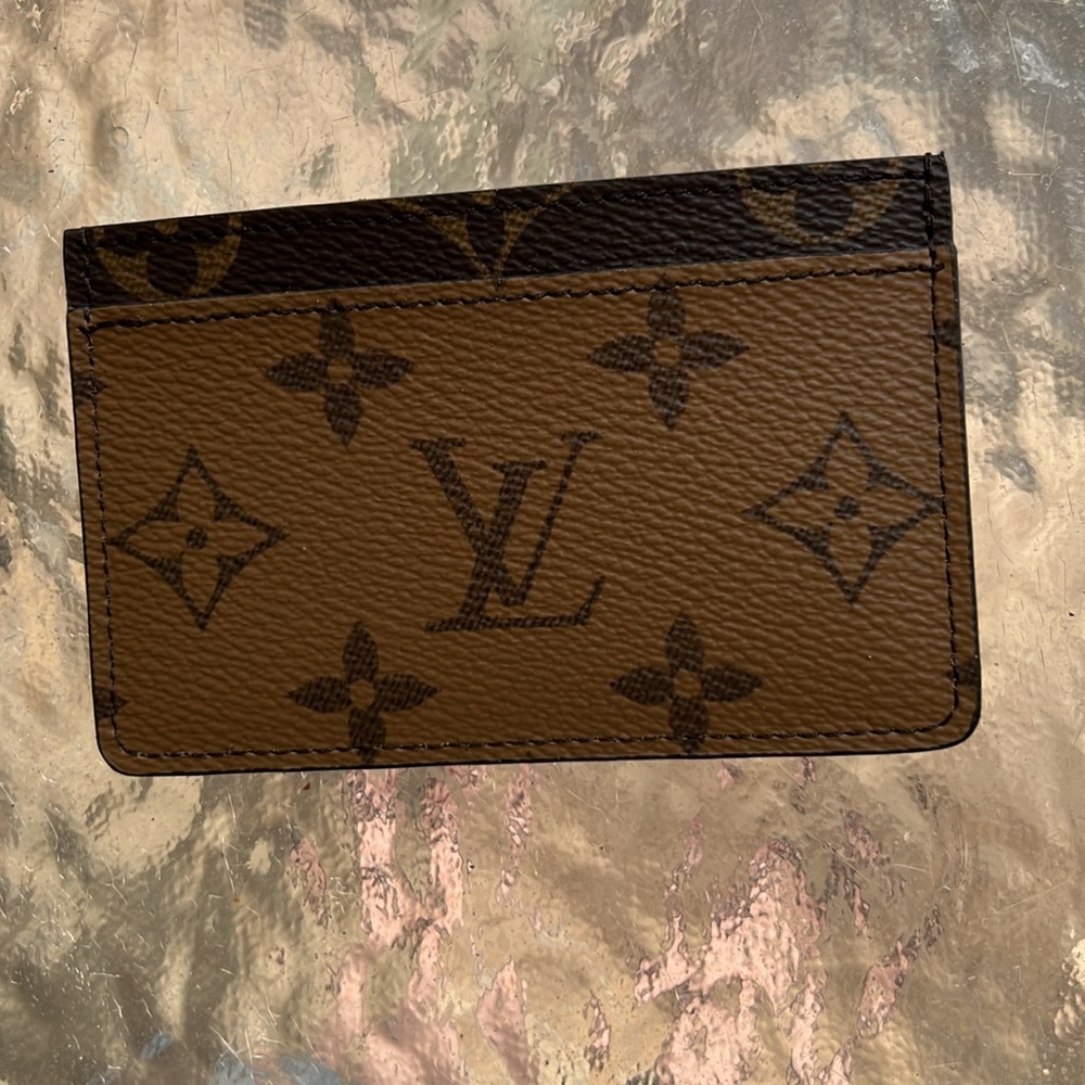 Louis Vuitton reversible BN card case, brand new, comes with pouch and box.